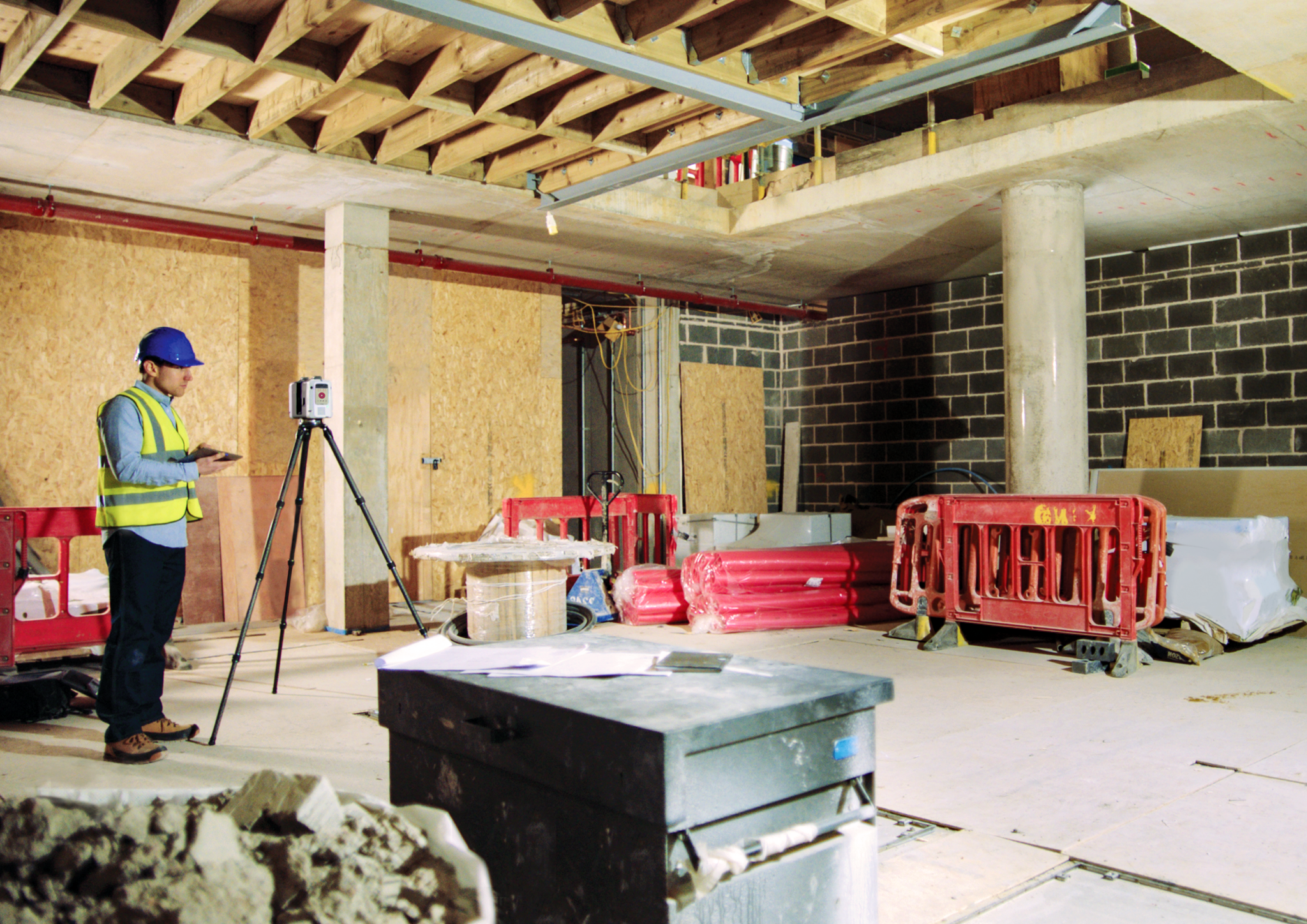 Man scanning a construction site with a Leica Geosystems RTC360