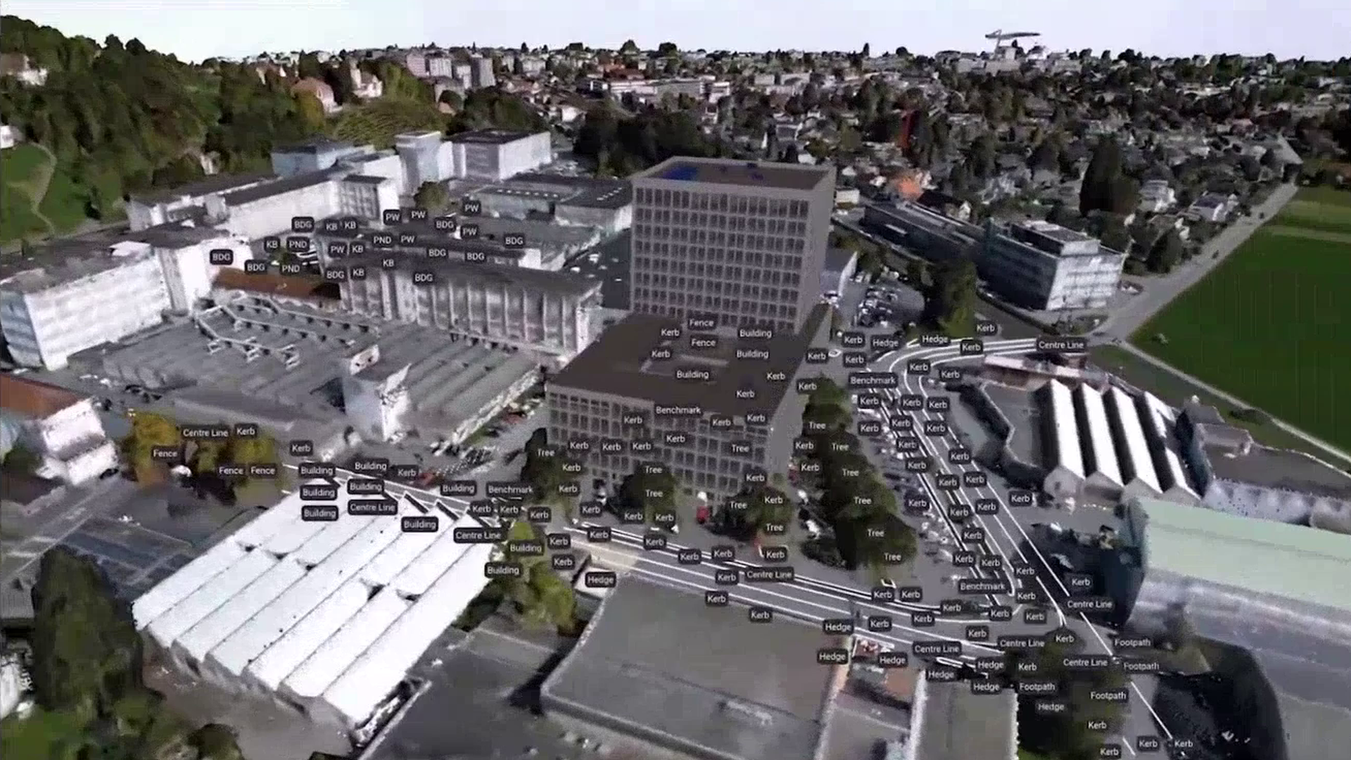 Aerial 3D mesh of the Leica Geosystems Heerbrugg campus with buildings, kerbs and trees automatically classified.